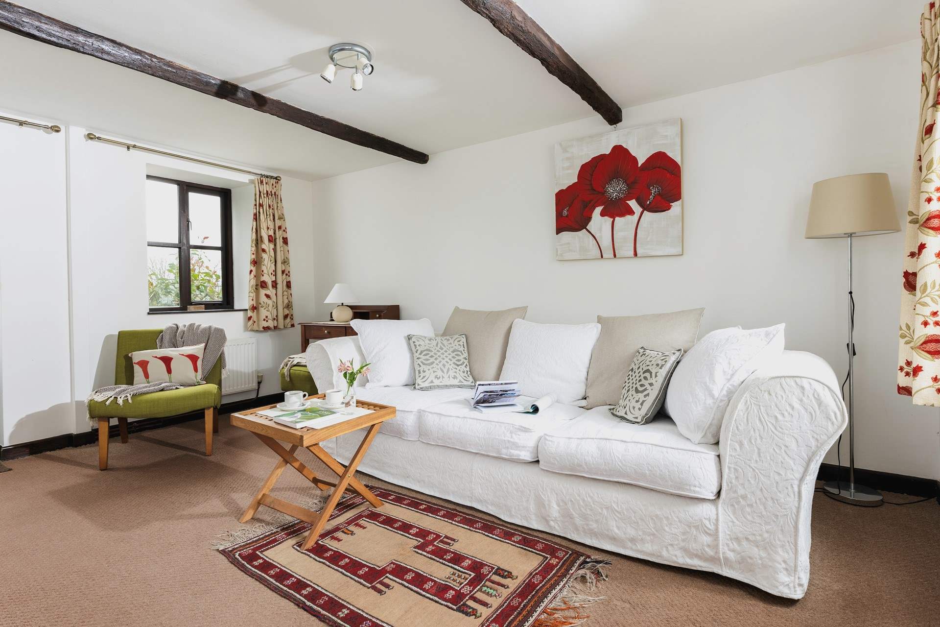 The gorgeous sitting-room leads out to the patio and garden.