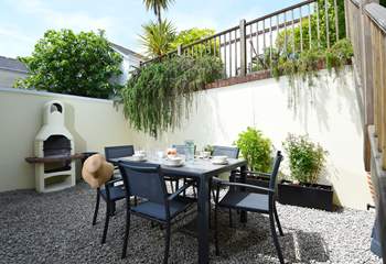 A pretty gravelled garden area at the back is the perfect spot for al fresco dining.
