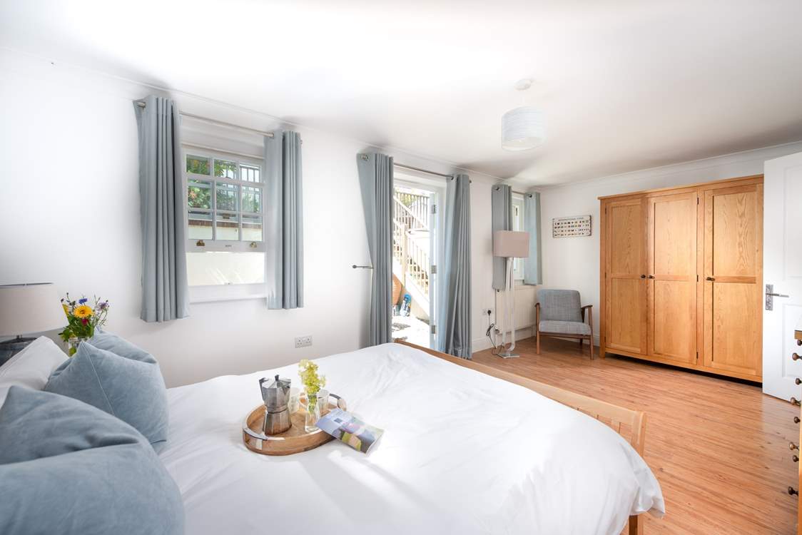 Gorgeous bedroom 2 has access to the patio, perfect for your morning coffee.