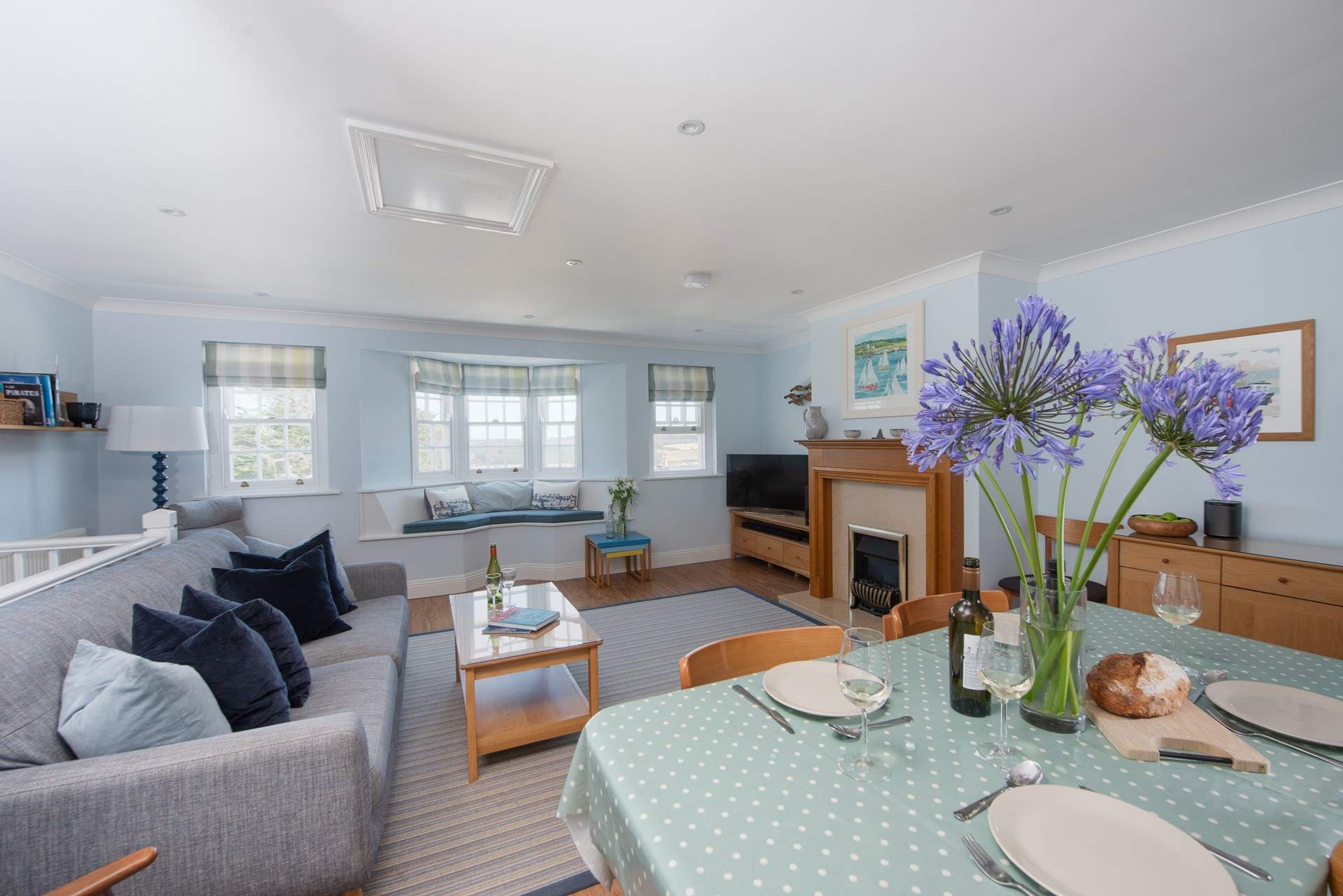 The open plan sitting/dining-room is cosy and inviting. 