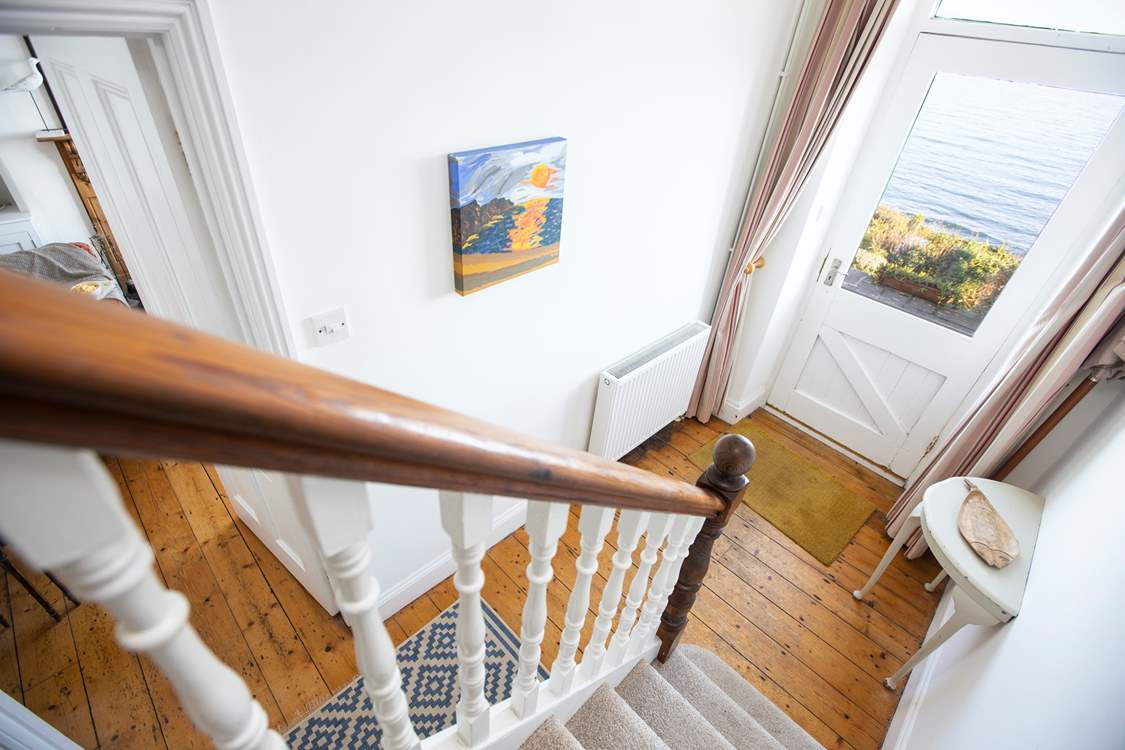 The traditional staircase to the first and second floors.