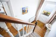 The traditional staircase to the first and second floors.
