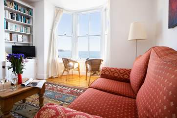 The sitting room has an open fire, perfect for cooler months.