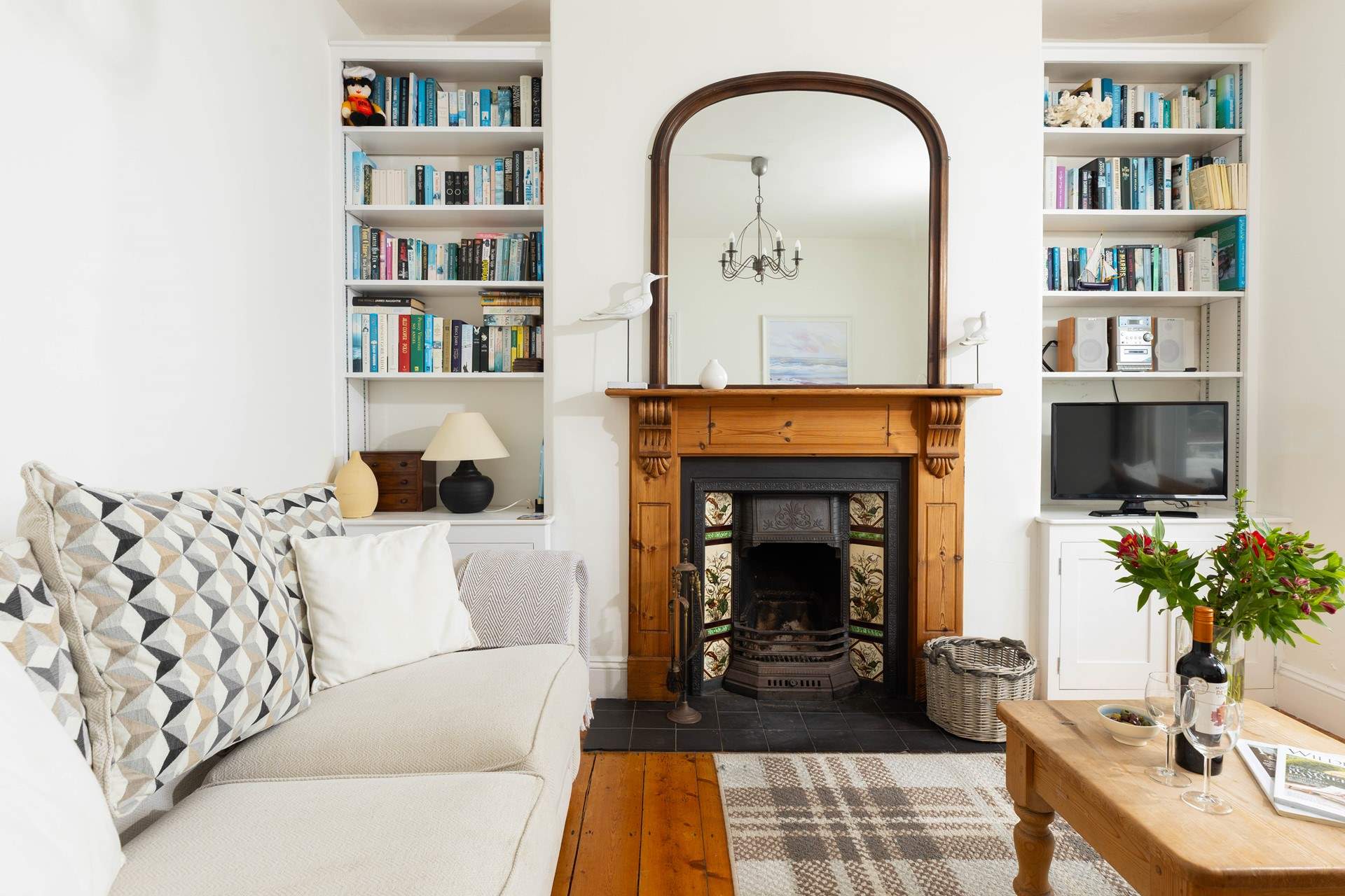 The sitting room has an open fire, perfect for cooler months.