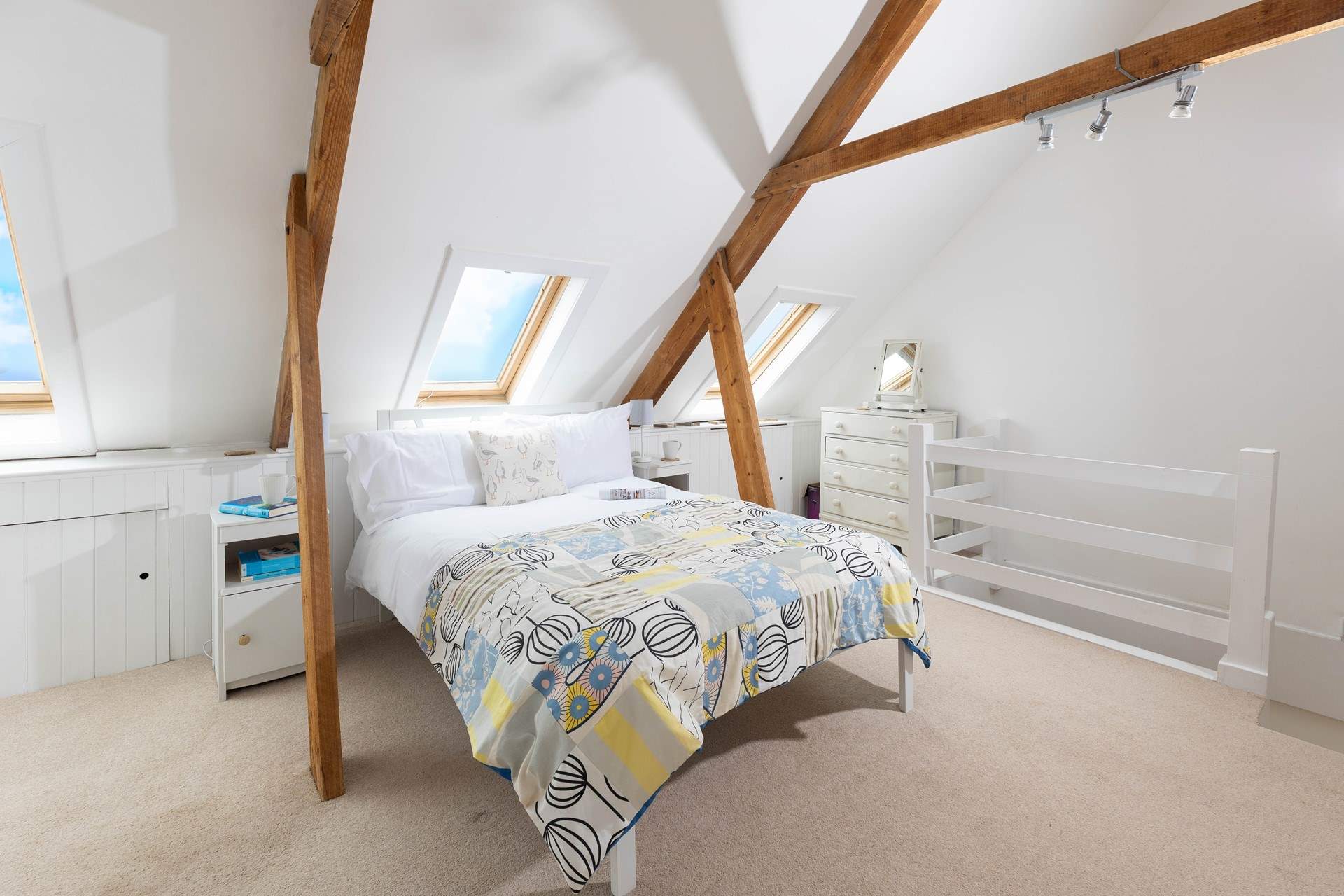 The second floor is home to this charming bedroom. 