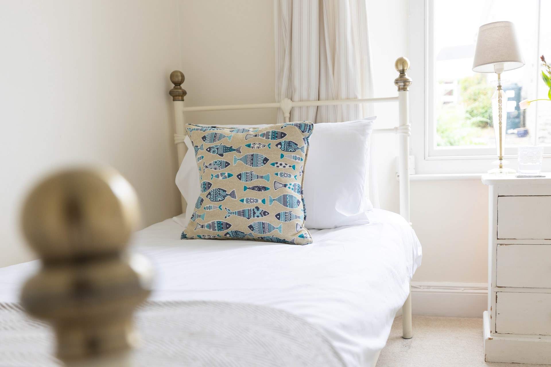 Pretty linens await in the twin bedroom. 