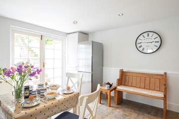 French doors lead out from the kitchen to the rear terrace.