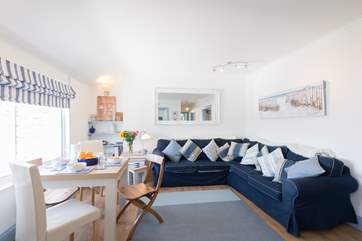 The light and bright open plan sitting/dining-room.