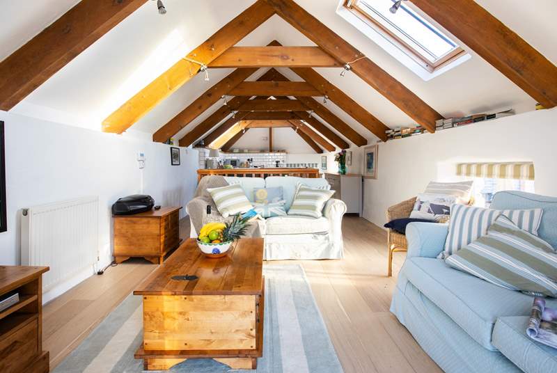 The barn has vaulted beamed ceilings with velux windows that let the light flood in.