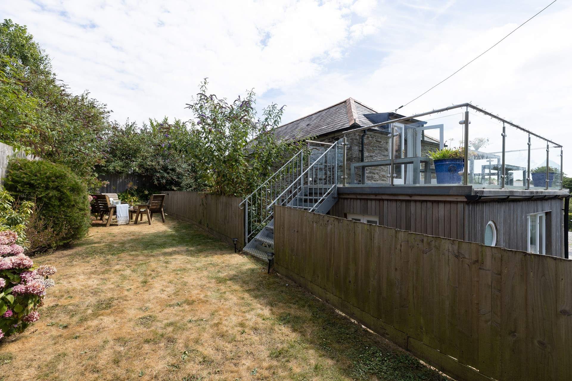 The steps lead from the terrace to the garden. 