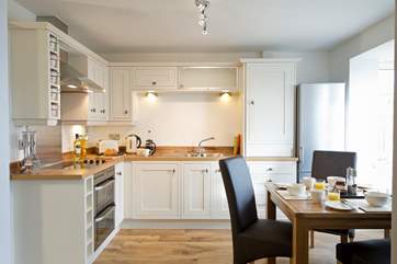 The kitchen/diner has a large bay window that looks out over the deck and garden.