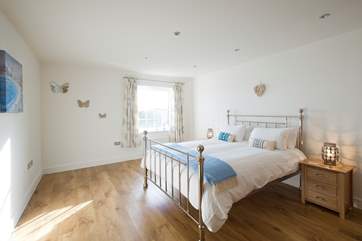 Bedroom 1 enjoys views over Gerrans Bay.