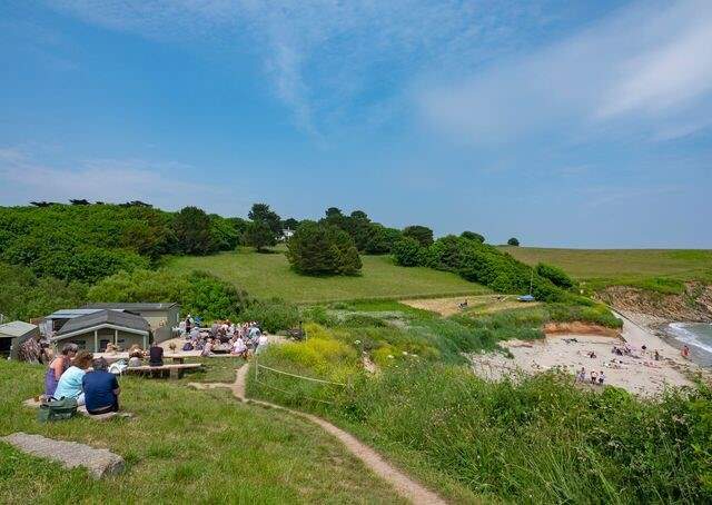 Wander along the coast path to The Hidden Hut.