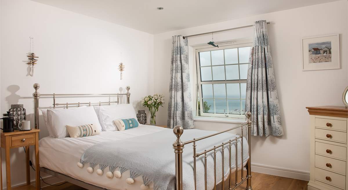 Bedroom 4 has a gorgeous bedstead and far reaching sea views. 