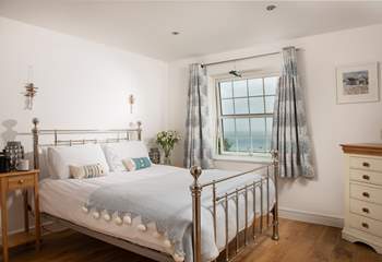 Bedroom 4 has a gorgeous bedstead and far reaching sea views. 