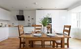 The stylish kitchen and dining table. - Thumbnail Image