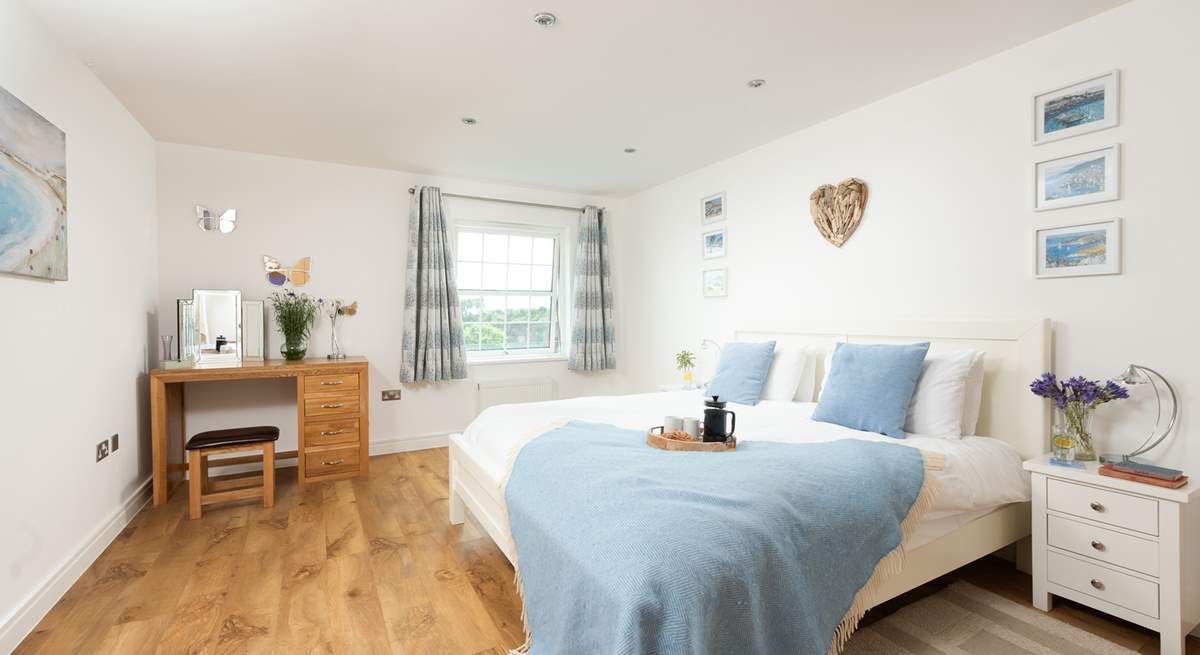 This pretty bedroom has a seaside theme. 