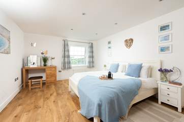 This pretty bedroom has a seaside theme.