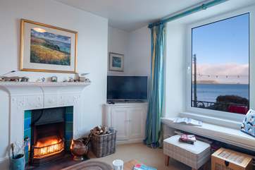 The sitting room has a cosy fire.
