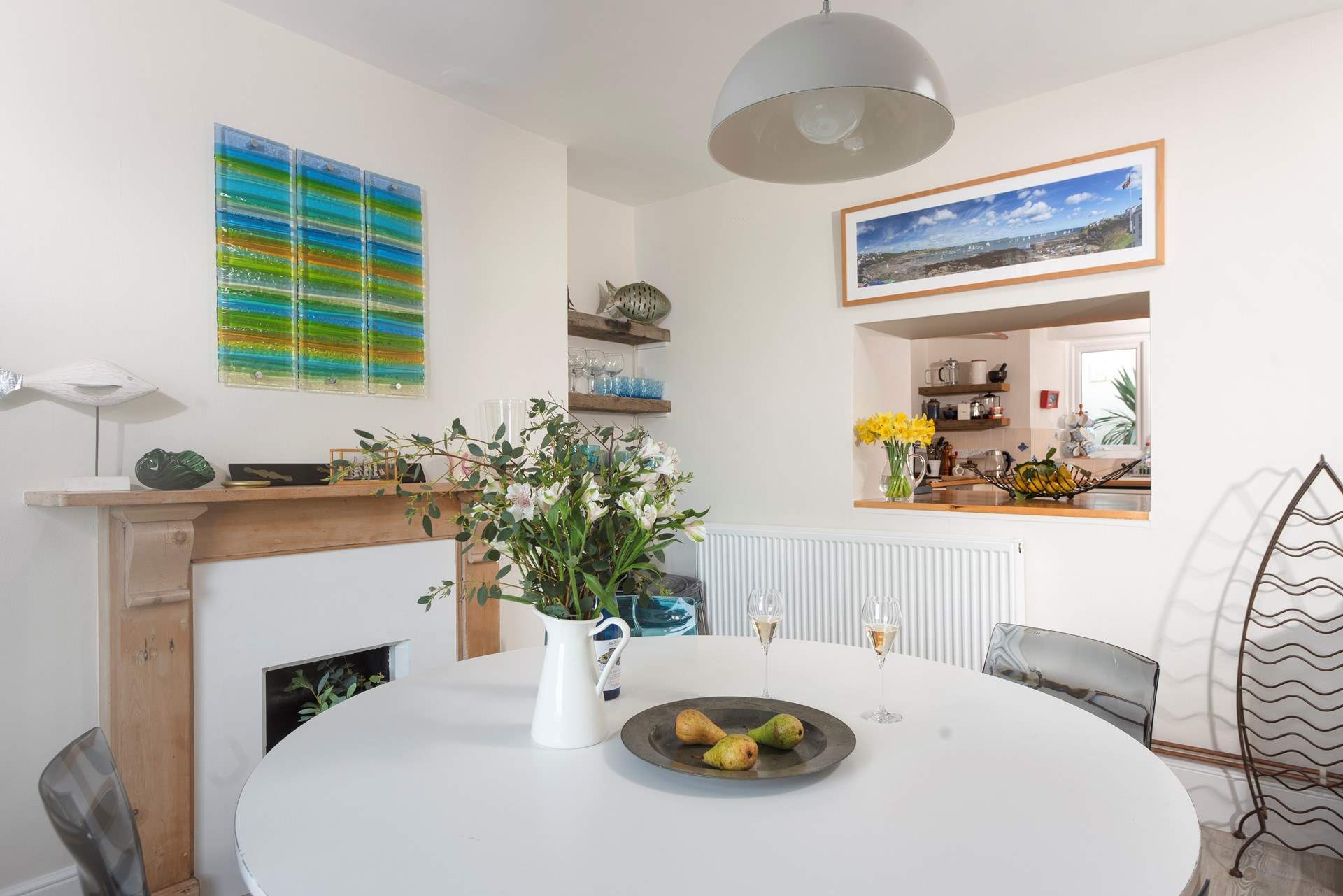The dining-room also has an ornamental fireplace. 