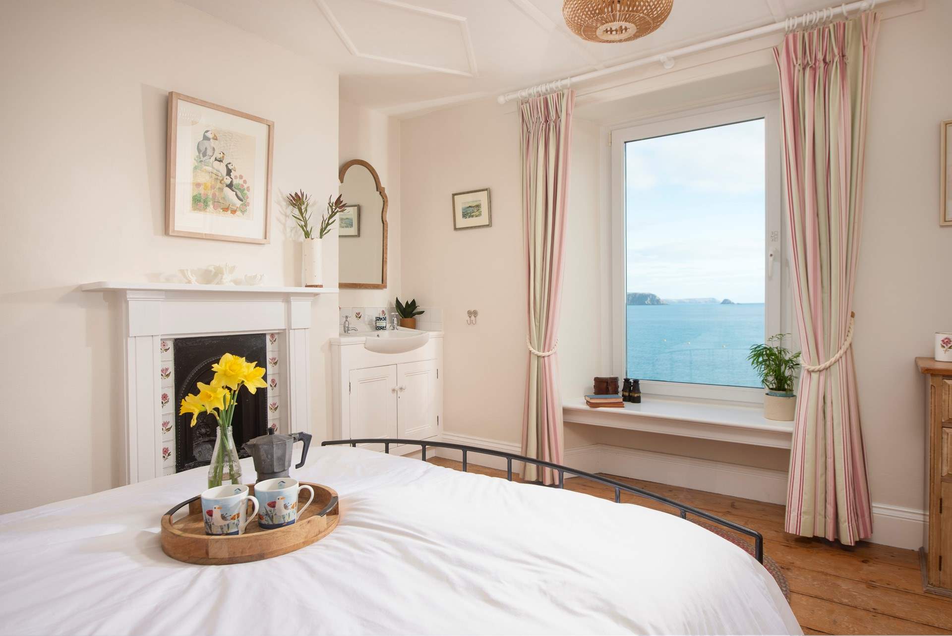 Bedroom 1 has a king-size double bed and wash-basin located in the corner. 