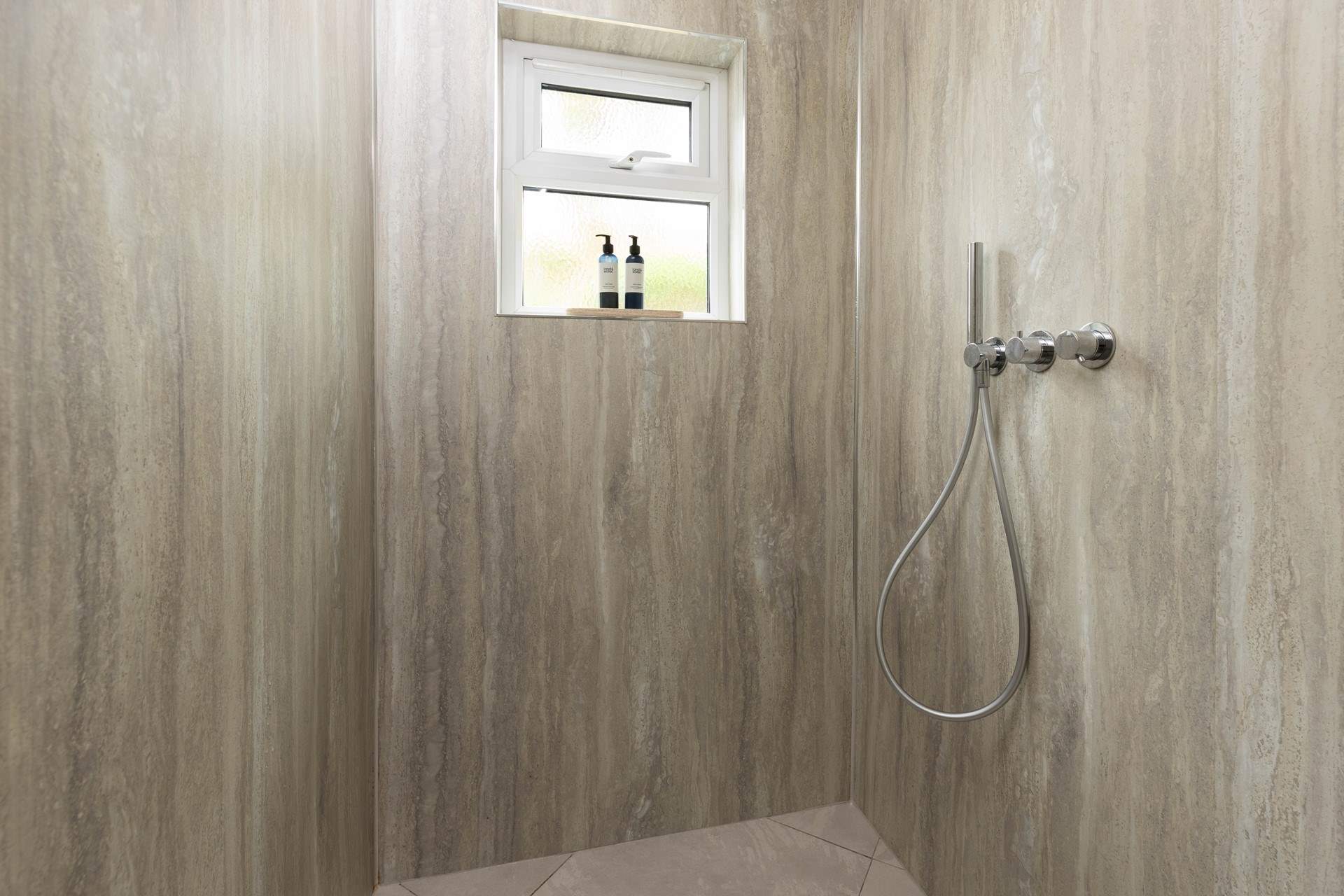The walk-in shower, ideal for washing sandy toes.