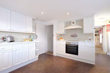 The kitchen leads through to the dining-room.
