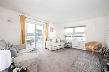 The sitting-room has access onto the balcony.