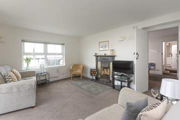 The cosy sitting-room, leading on from the dining room.