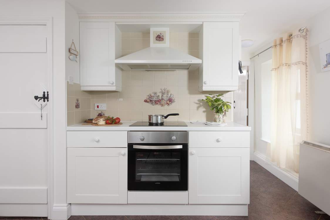 The kitchen leads through to the dining-room.