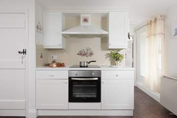 The kitchen leads through to the dining-room.