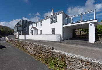 The exterior of the house (parking is just past the front of the house under the raised terrace).