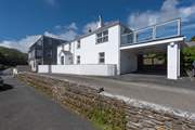 The exterior of the house (parking is just past the front of the house under the raised terrace).