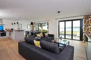 Doors from the living room open out to the decked area.