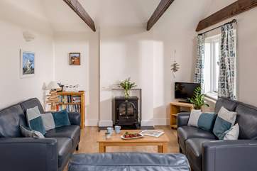 The pretty sitting room is cosy and characterful.