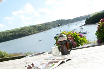 Enjoy morning coffee overlooking the water.