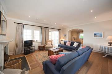The sitting-room has french doors to conservatory.