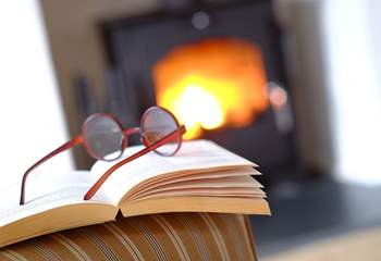 Snuggle up in front of the wood-burner with a good book.