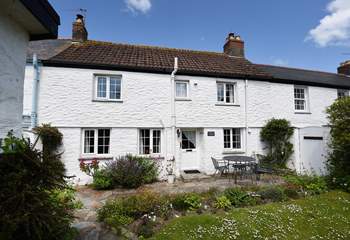 Enjoy the pretty garden at Driftwood Cottage.