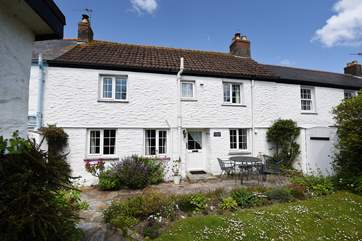 Enjoy the pretty garden at Driftwood Cottage.