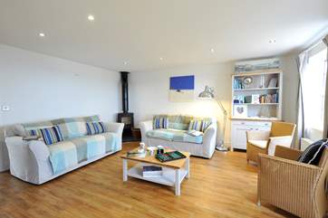 The cosy living-room with wood-burner to keep you warm in cooler months.