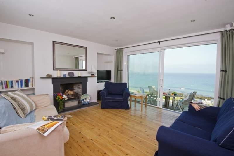 The living-room offers lovely sea views through the large double doors.