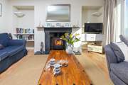 The living room has a wood burner to keep you warm throughout the year.