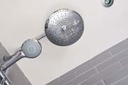 The family bathroom has a shower over the bath.