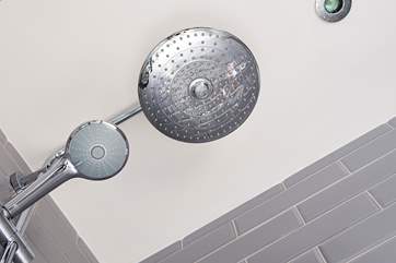 The family bathroom has a shower over the bath.