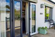French doors lead out on to the decked area.