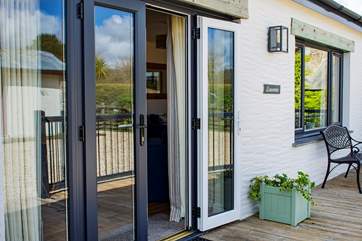 French doors lead out on to the decked area.