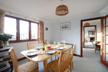 The dining-room looking through to the hall and sitting-room.