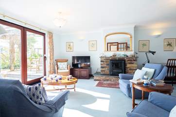 The cosy sitting-room is the perfect place to relax after a busy day.