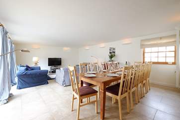 Plenty of seating for everyone around the dining-table.